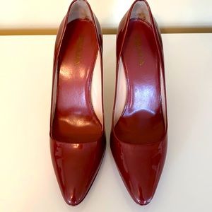 Authentic Prada red leather pumps.